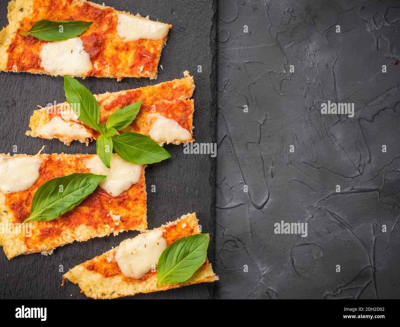 Homemade cauliflower pizza crust with mozarella Stock Photo