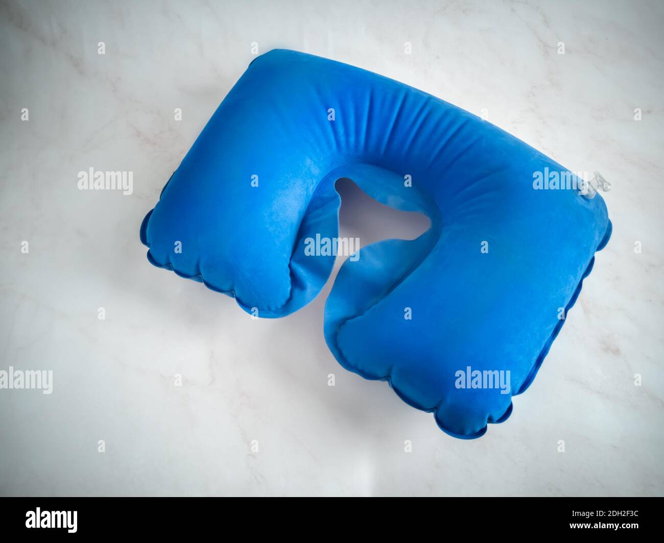Blue inflatable pillow for comfortable neck position Stock Photo