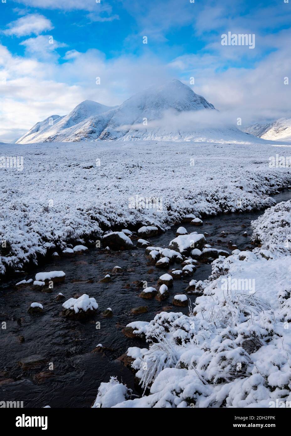Winter view of snow covered Buachaille Etive Mor mountain and River Coupall in Glen Coe, Scotland, UK Stock Photo