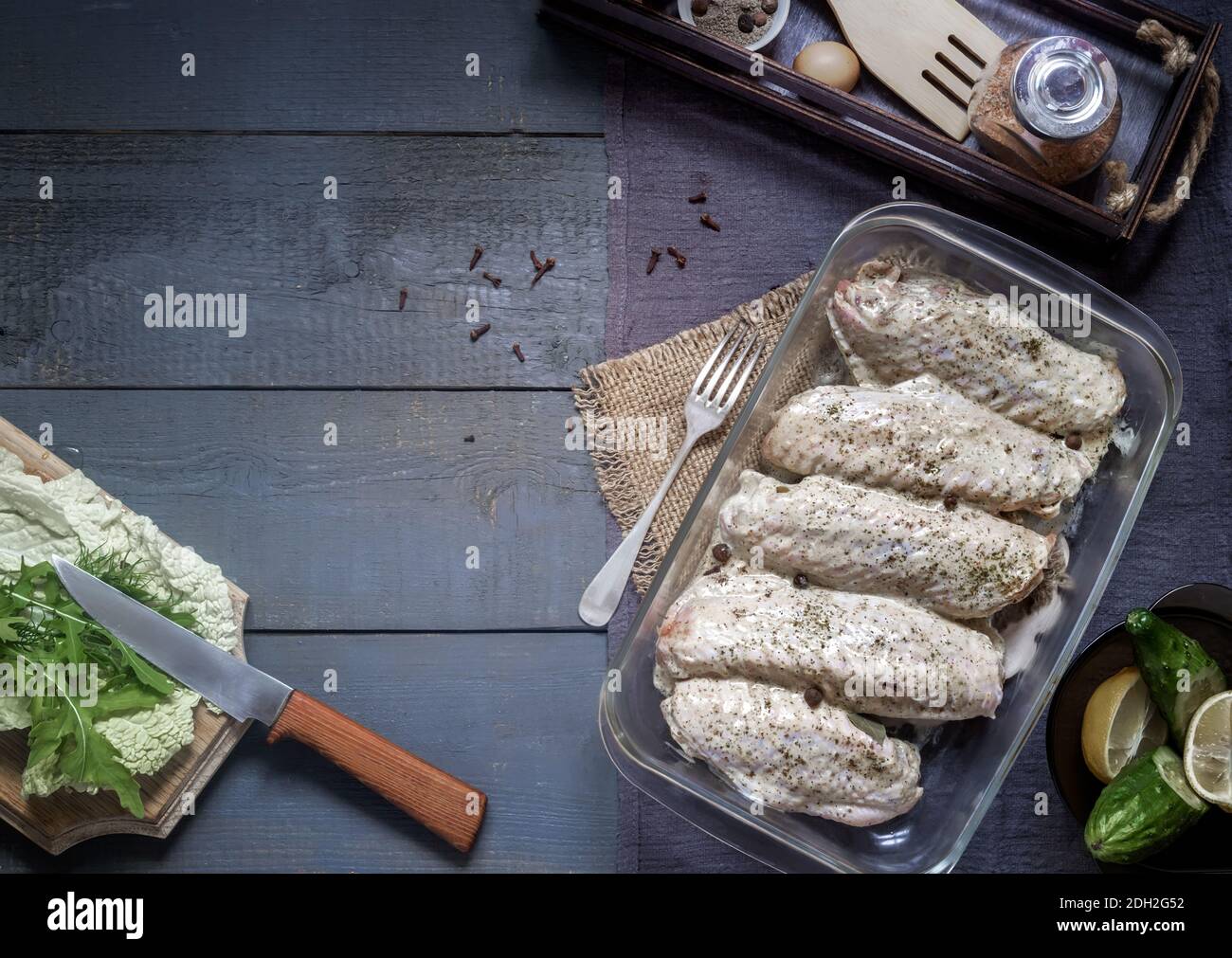 Turkey wings in a marinade with spices for frying. Stock Photo