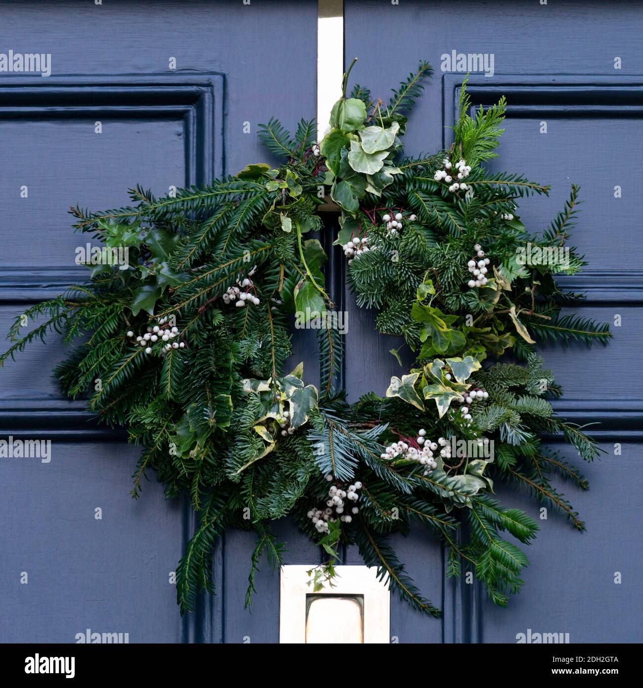 Detail of traditional Christmas wreath on front door of house in New Town of Edinburgh, Scotland, UK Stock Photo