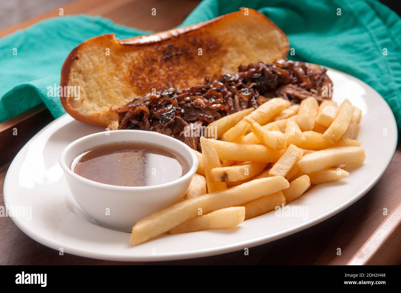 classic french dip au jus or beef dip with fries and sauteed onions