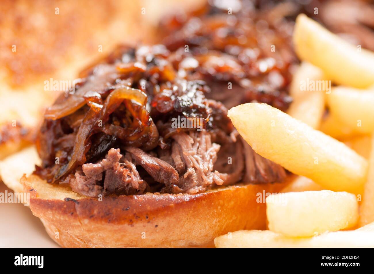 classic french dip au jus or beef dip with fries and sauteed onions