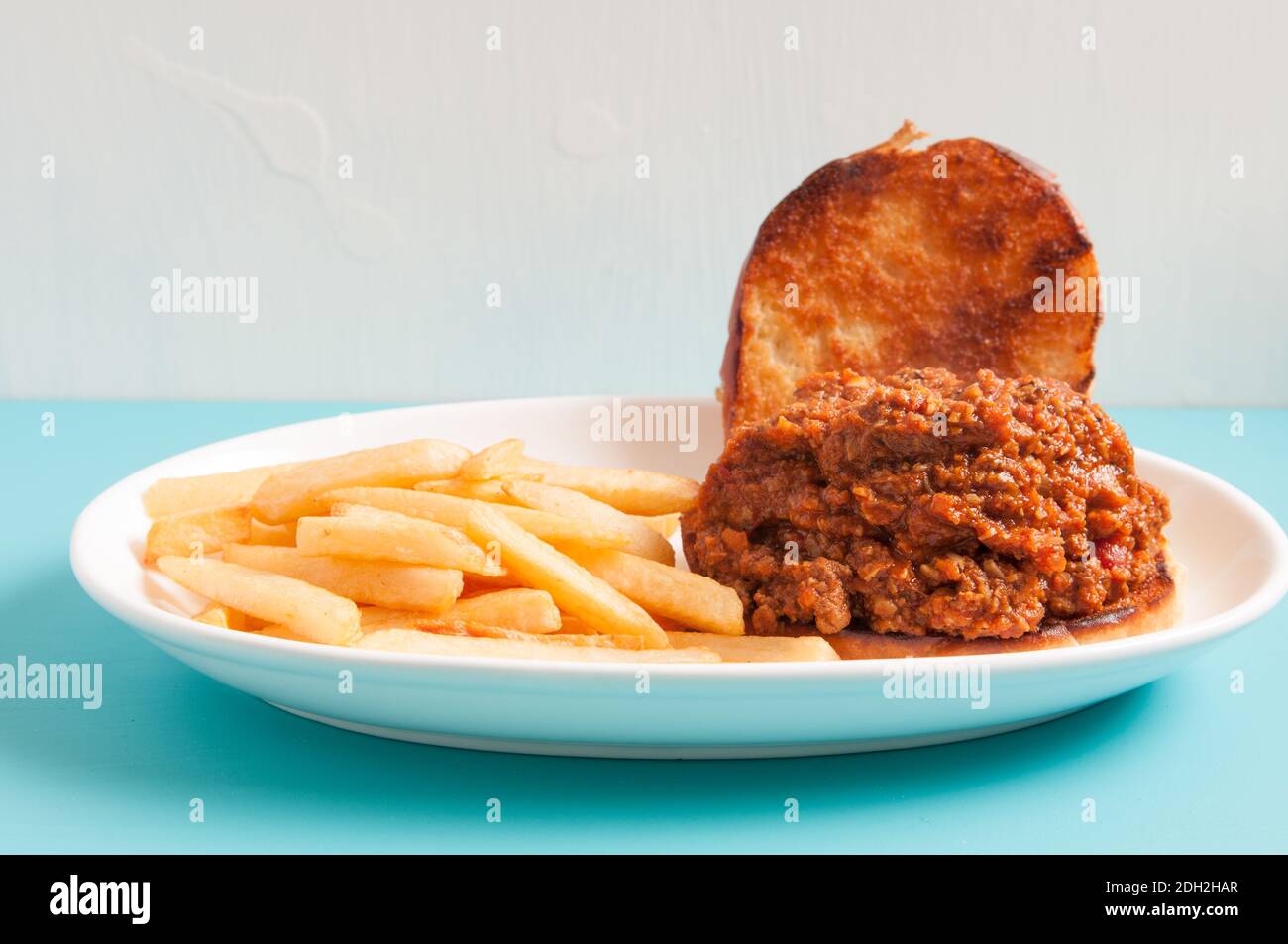 sloppy joe sandwich with french fries Stock Photo - Alamy