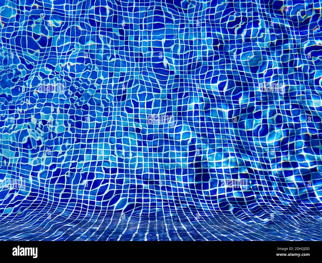 Swimming pool water with ripples and refractions on blue tiles Stock Photo