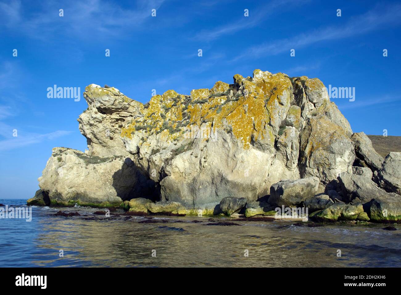 A huge stone statue on the shores of the Azov sea. Stock Photo
