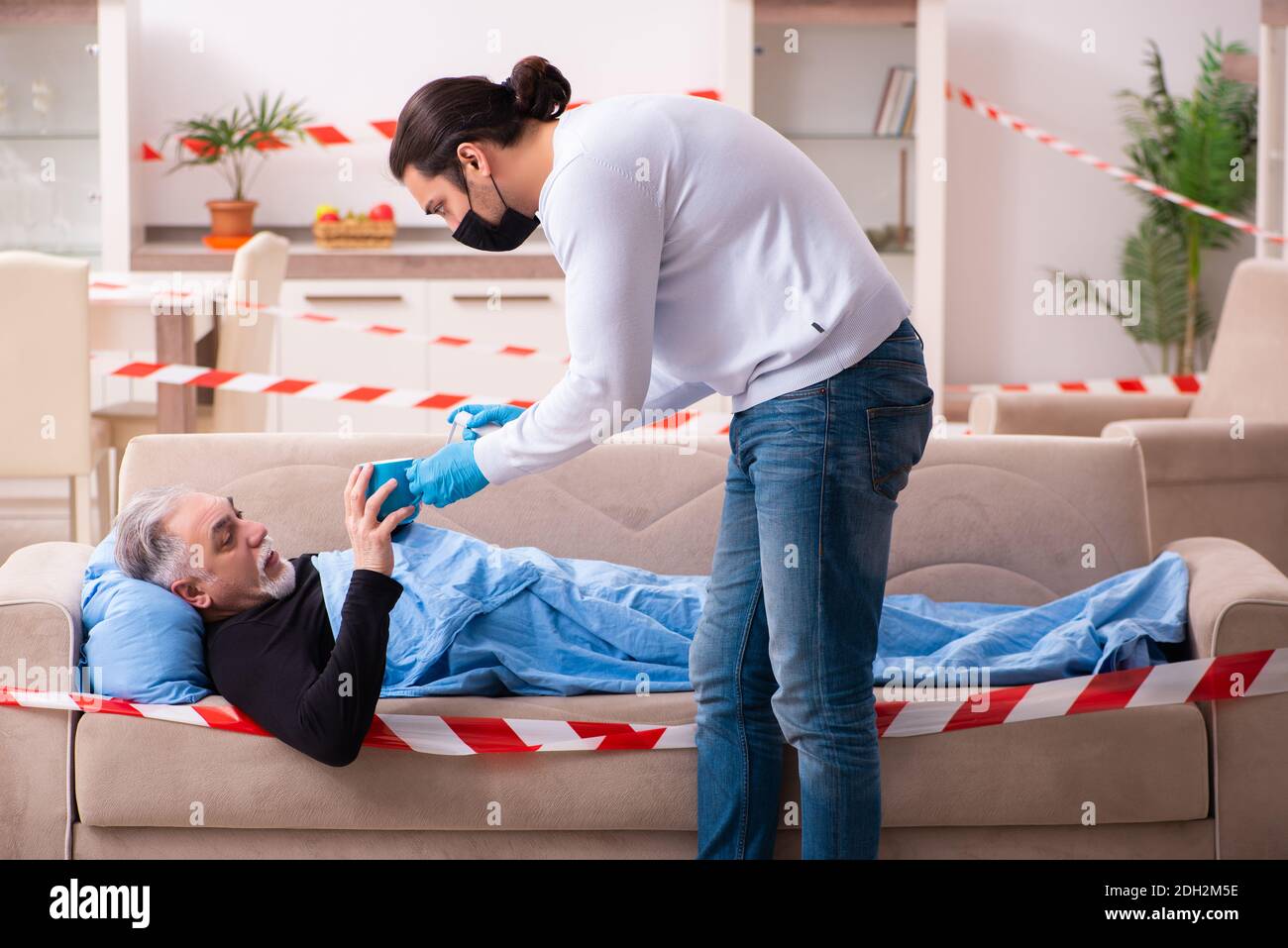 Father and son in coronavirus disease concept at home Stock Photo