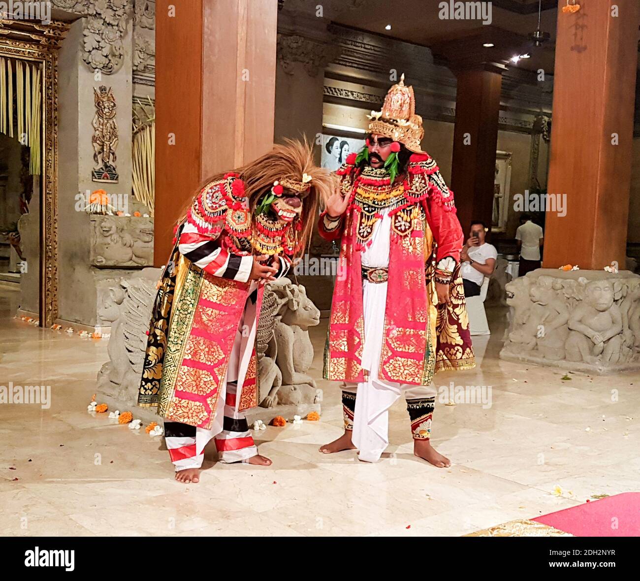 UBUD, BALI, INDONESIA - MAY 11, 2017: Dancers in traditional Balinese costumes perform the Ramayana Story dance with codified hand positions and eye m Stock Photo
