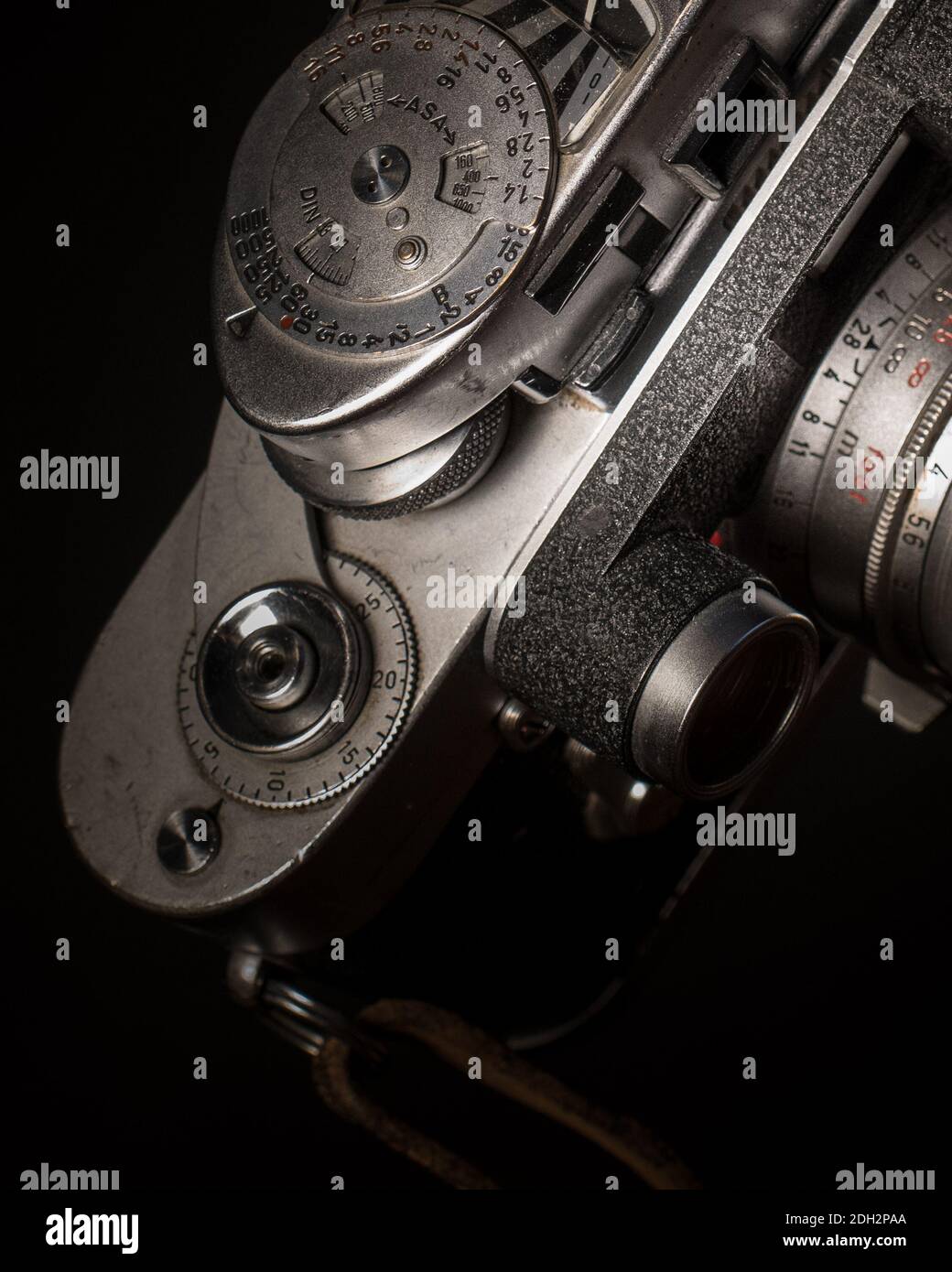 Vintage camera with rollfilm close up, half the camera body and lens