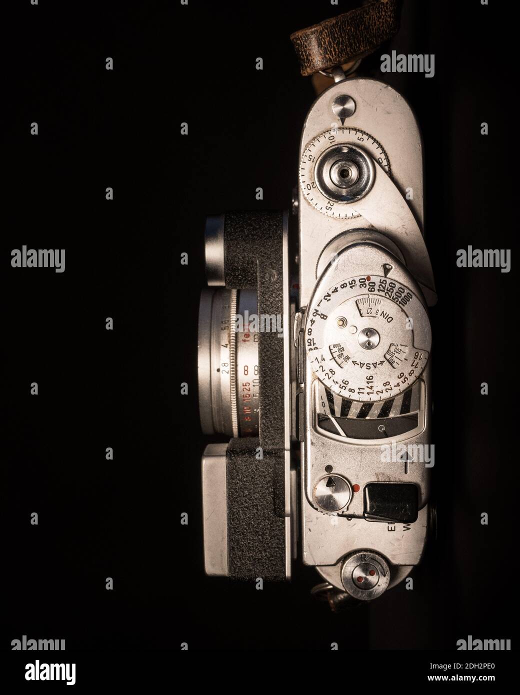 Vintage camera with rollfilm close up, half the camera body and lens