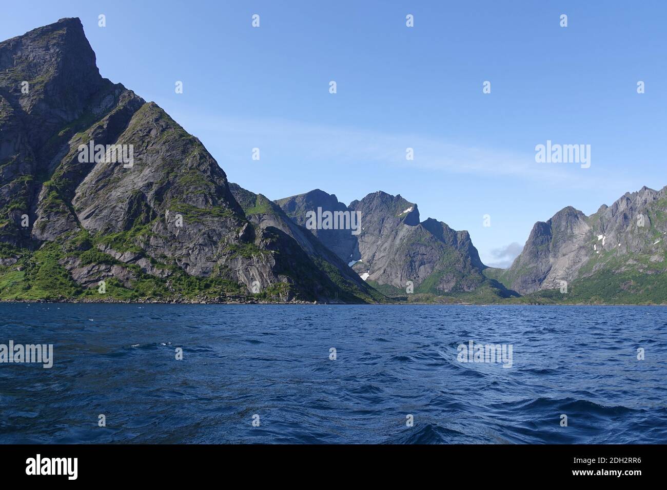 Rocky skyline from water in Lofoten Stock Photo