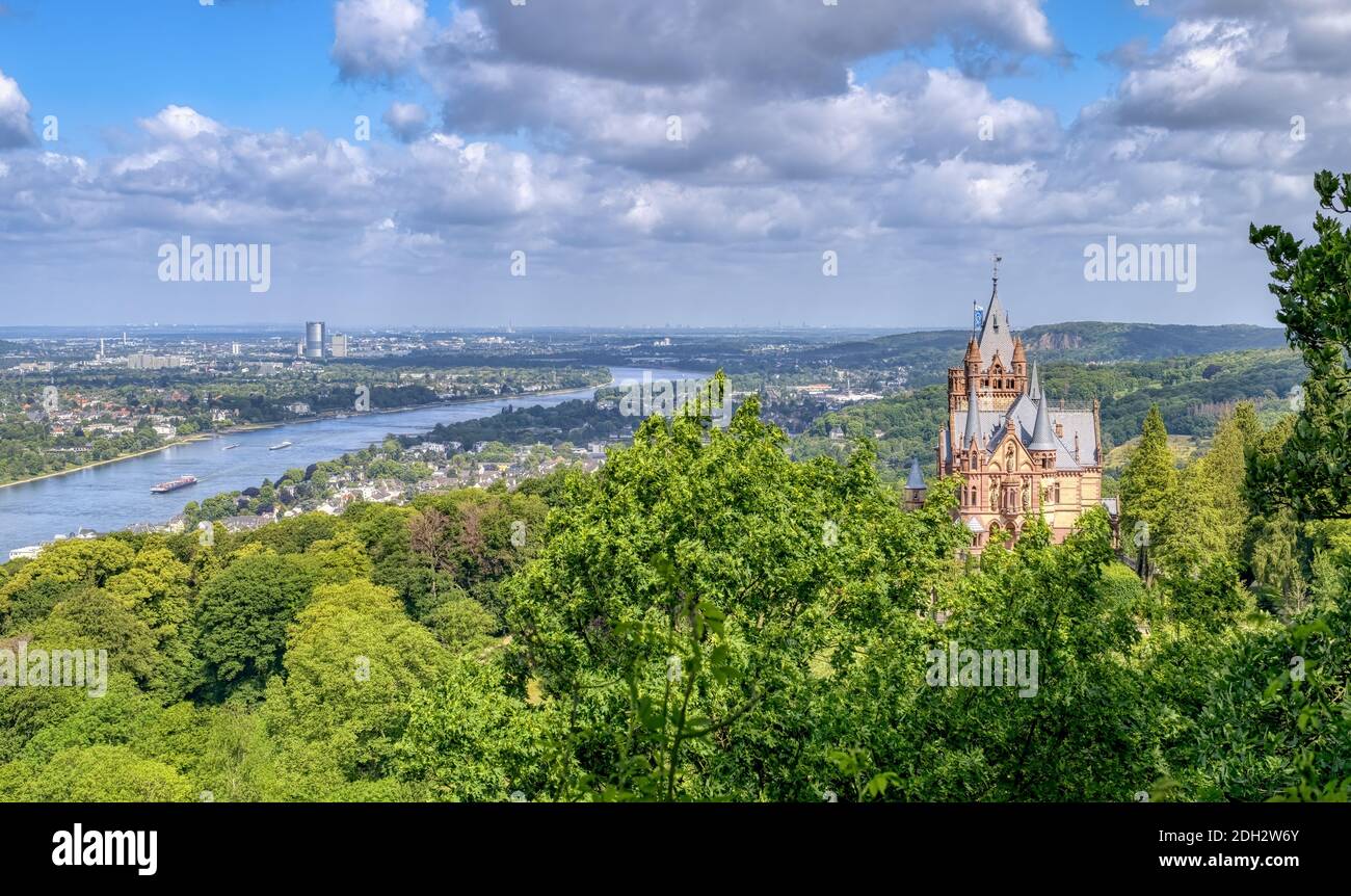 Panoramic view over the castle Drachenburg on the hill Drachenfels in Siebengebirge, town Königswinter and Bonn, river Rhine and Cologne Lowland, NRW Stock Photo