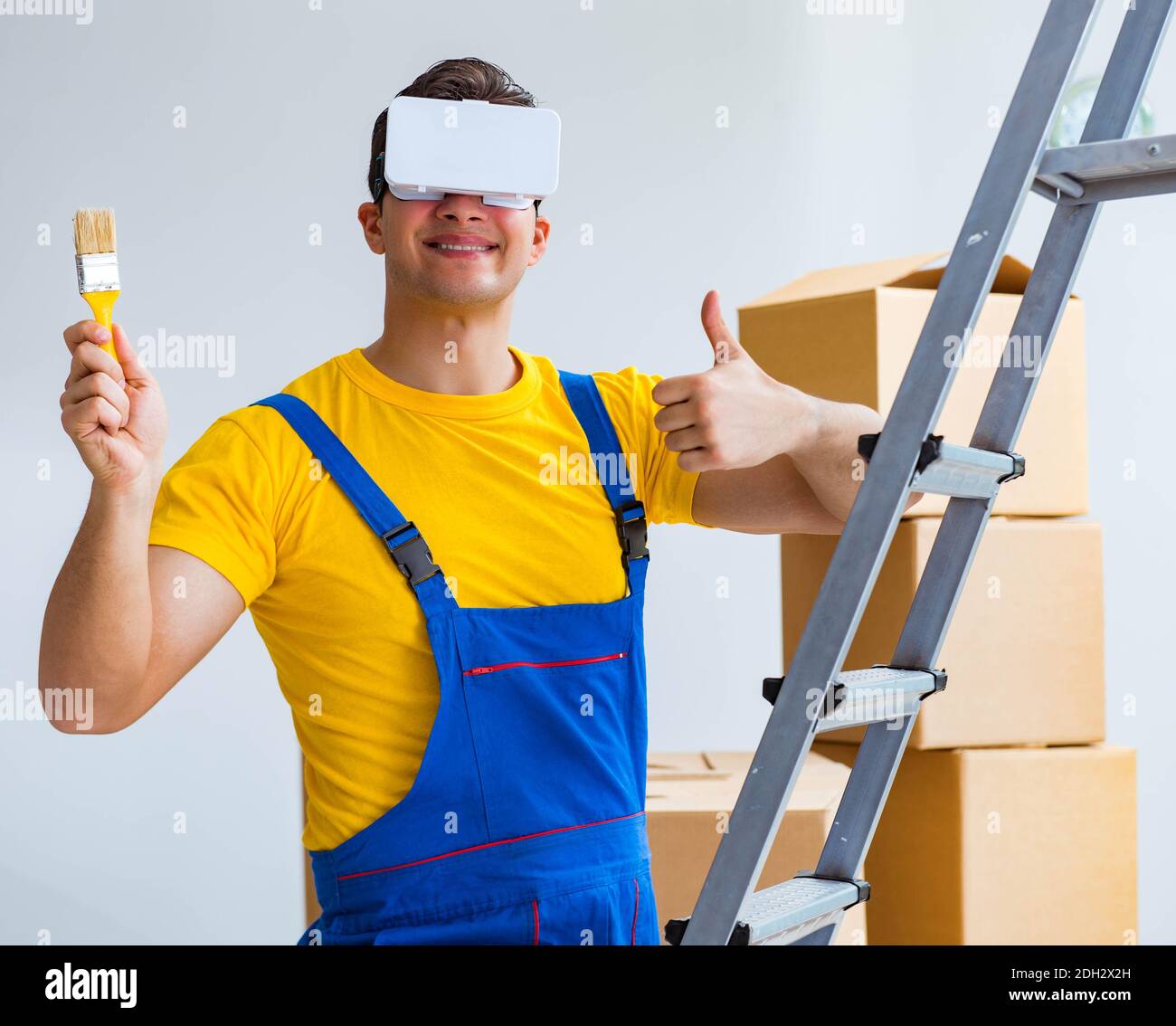 Painter contractor working with virtual reality goggles Stock Photo