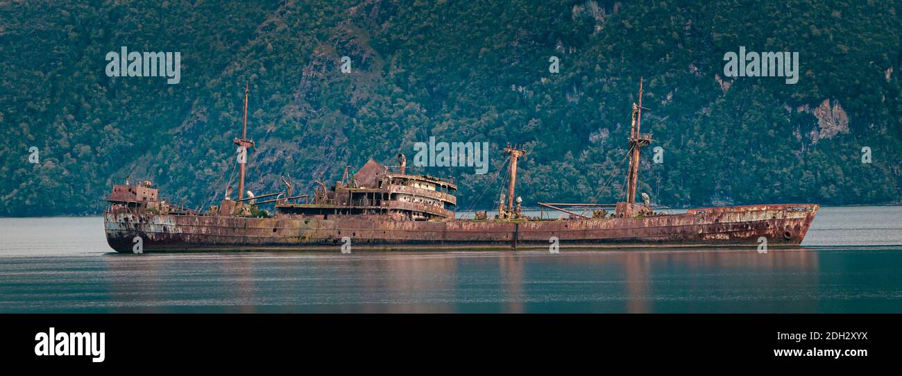 remains of the sunken ship Captain Leonidas in the fjords of southern Chile in Patagonia Stock Photo