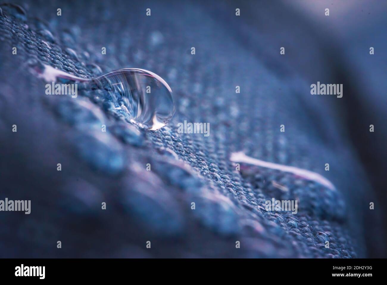 Water drops on impregnated waterproof fabric. Stock Photo