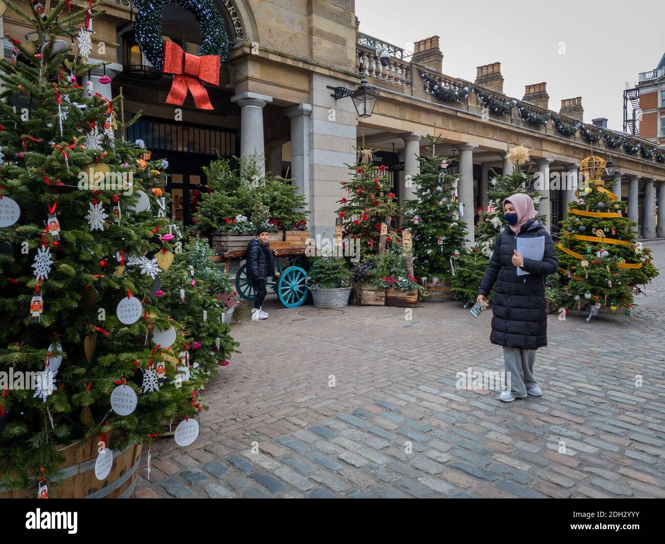 Christmas decorations in London Covent Garden with few visitors. Covid-19 lockdown and Covid Tiers have had serious impacted the hospitality industry. Stock Photo