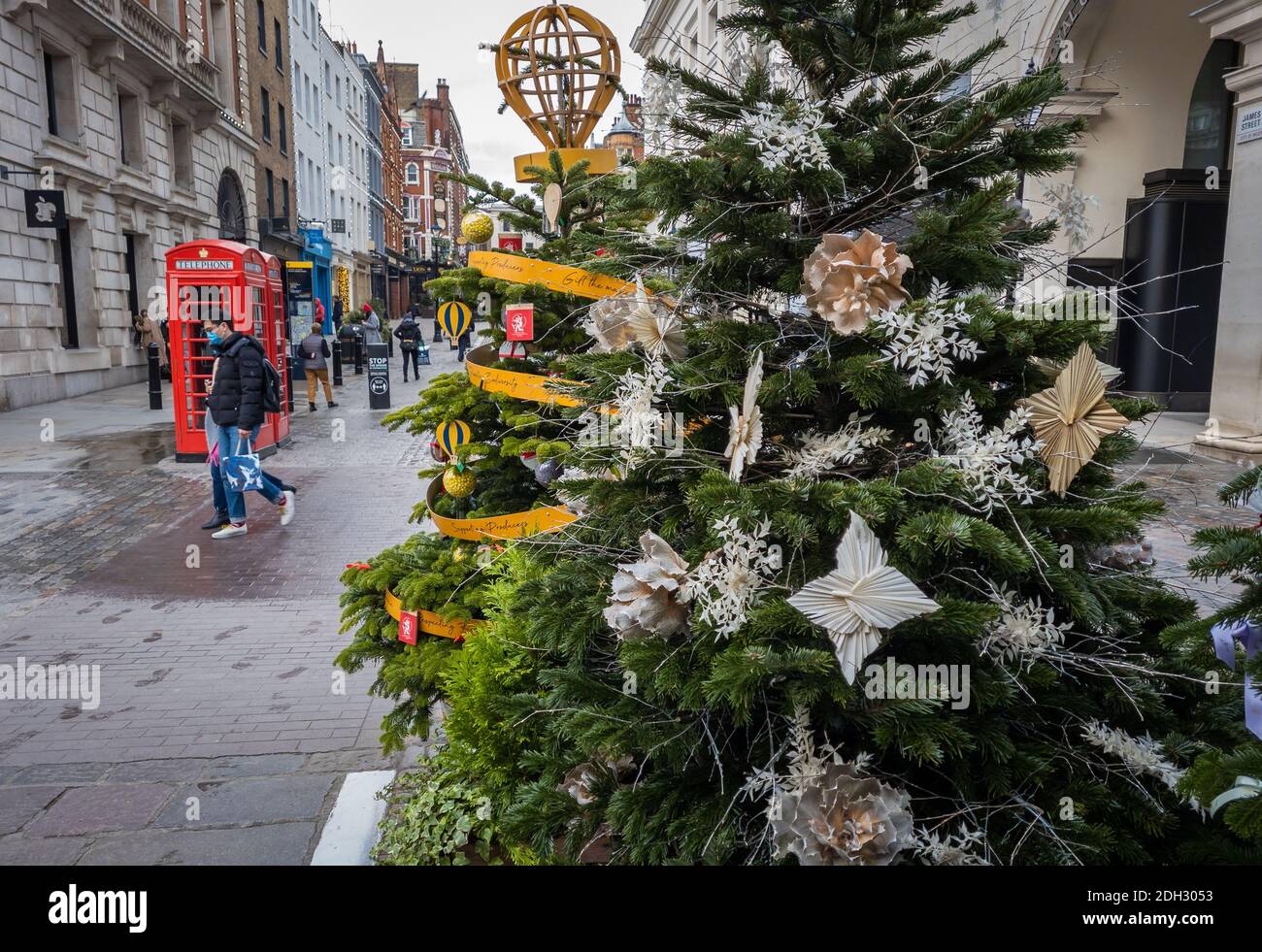 Christmas decorations in London Covent Garden with few visitors. Covid-19 lockdown and Covid Tiers have had serious impacted the hospitality industry. Stock Photo