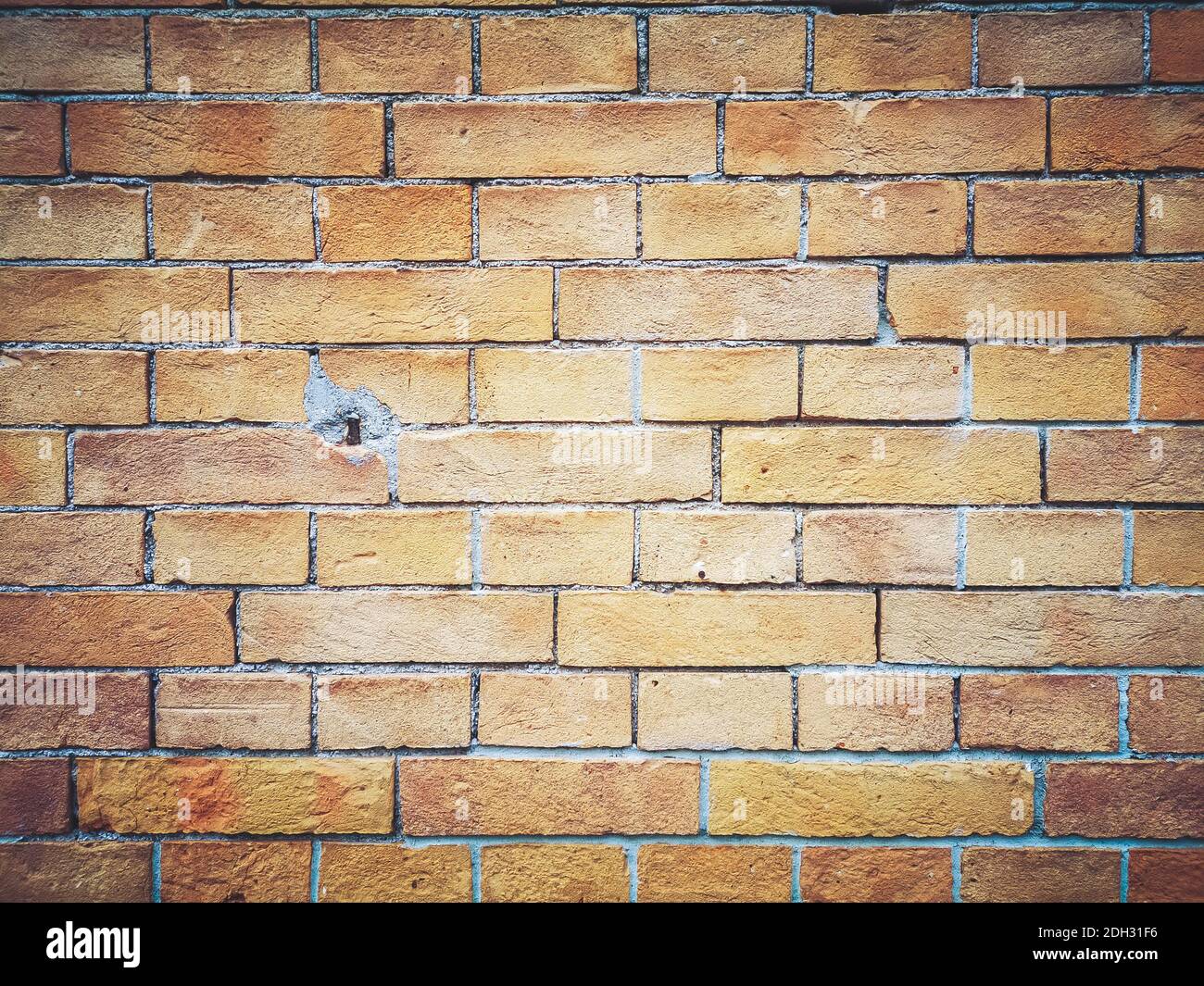 Brick wall background. Brown and red bricks, masonry texture of a building exterior Stock Photo