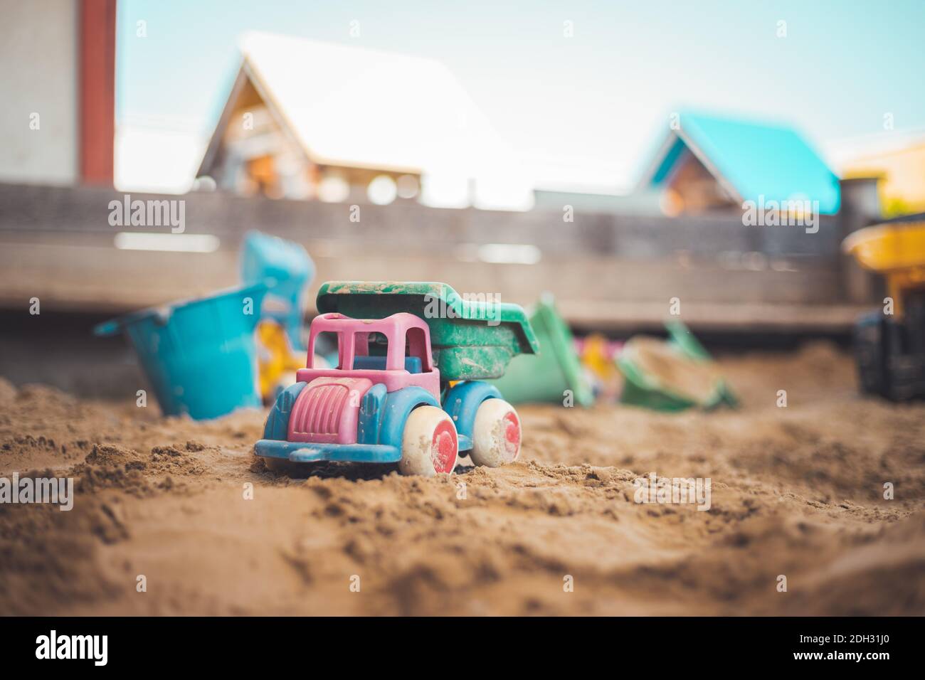 Childhood sandbox concept: Close up of plastic toy truck Stock Photo