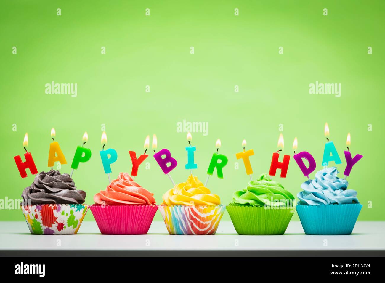 Happy birthday cupcakes in a row Stock Photo