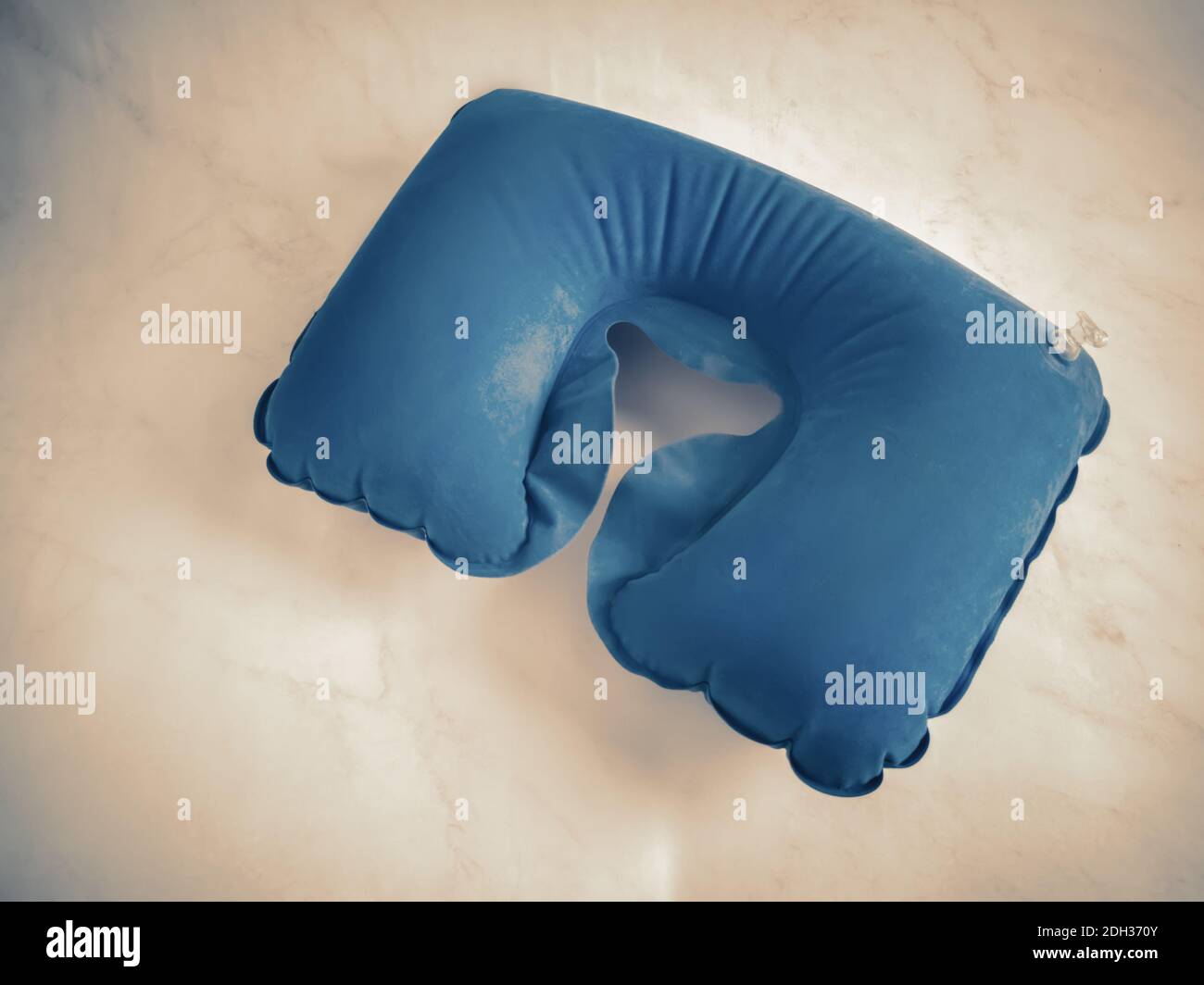 Blue inflatable pillow for comfortable neck position Stock Photo