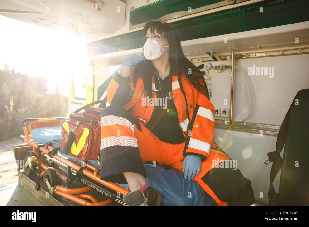 Young female paramedic sits in emergency vehicle Stock Photo - Alamy