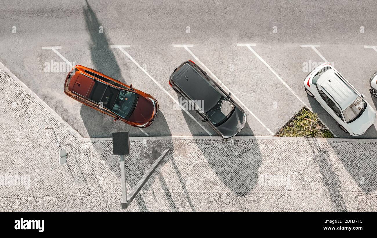Bad parking. Occupying two spaces. Improperly parked car. Double parking Stock Photo