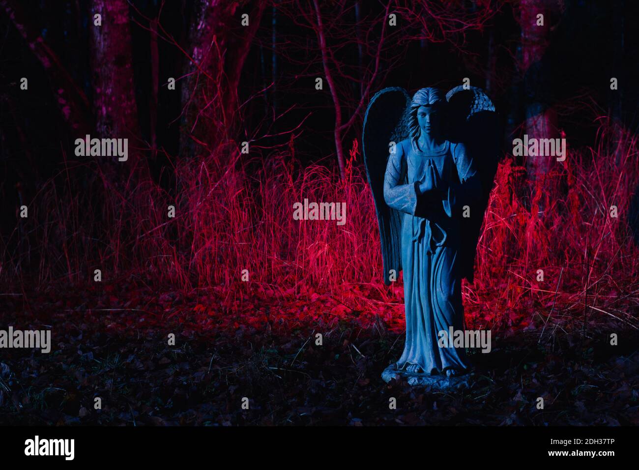 Angel statue bathed in moonlight Stock Photo