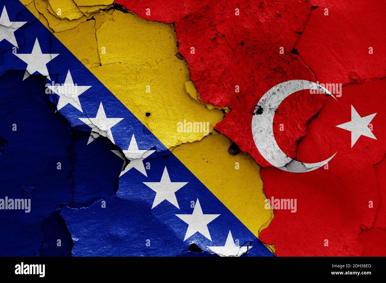 Flags of Bosnia and Herzegovina and Turkey painted on cracked wall Stock Photo