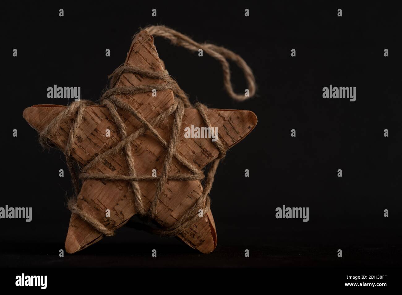 Close up portrait of Homemade Christmas Star on a black background Stock Photo