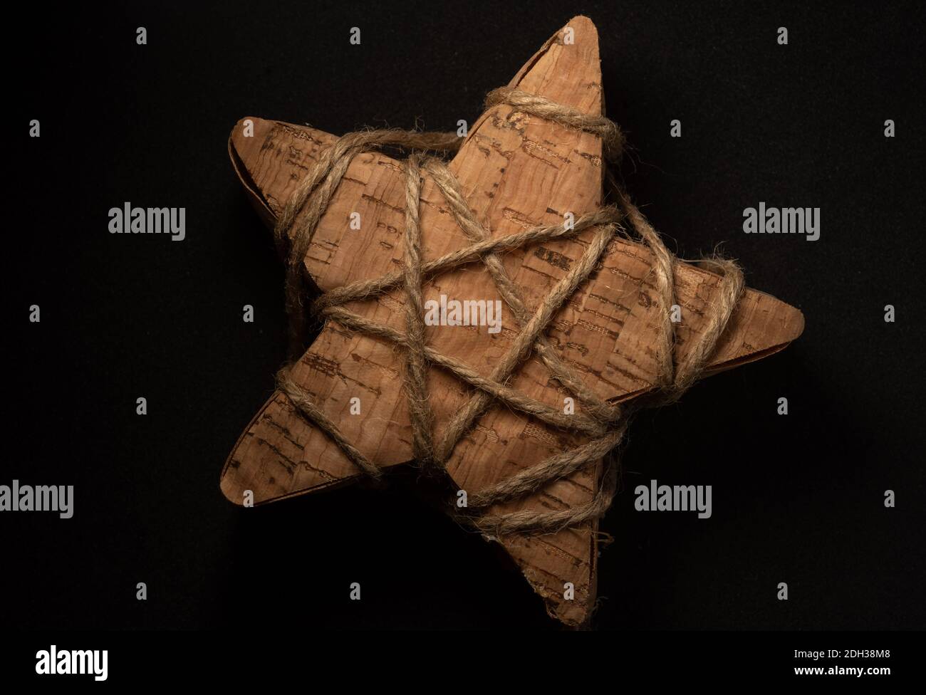 Close up portrait of Homemade Christmas Star on a black background Stock Photo