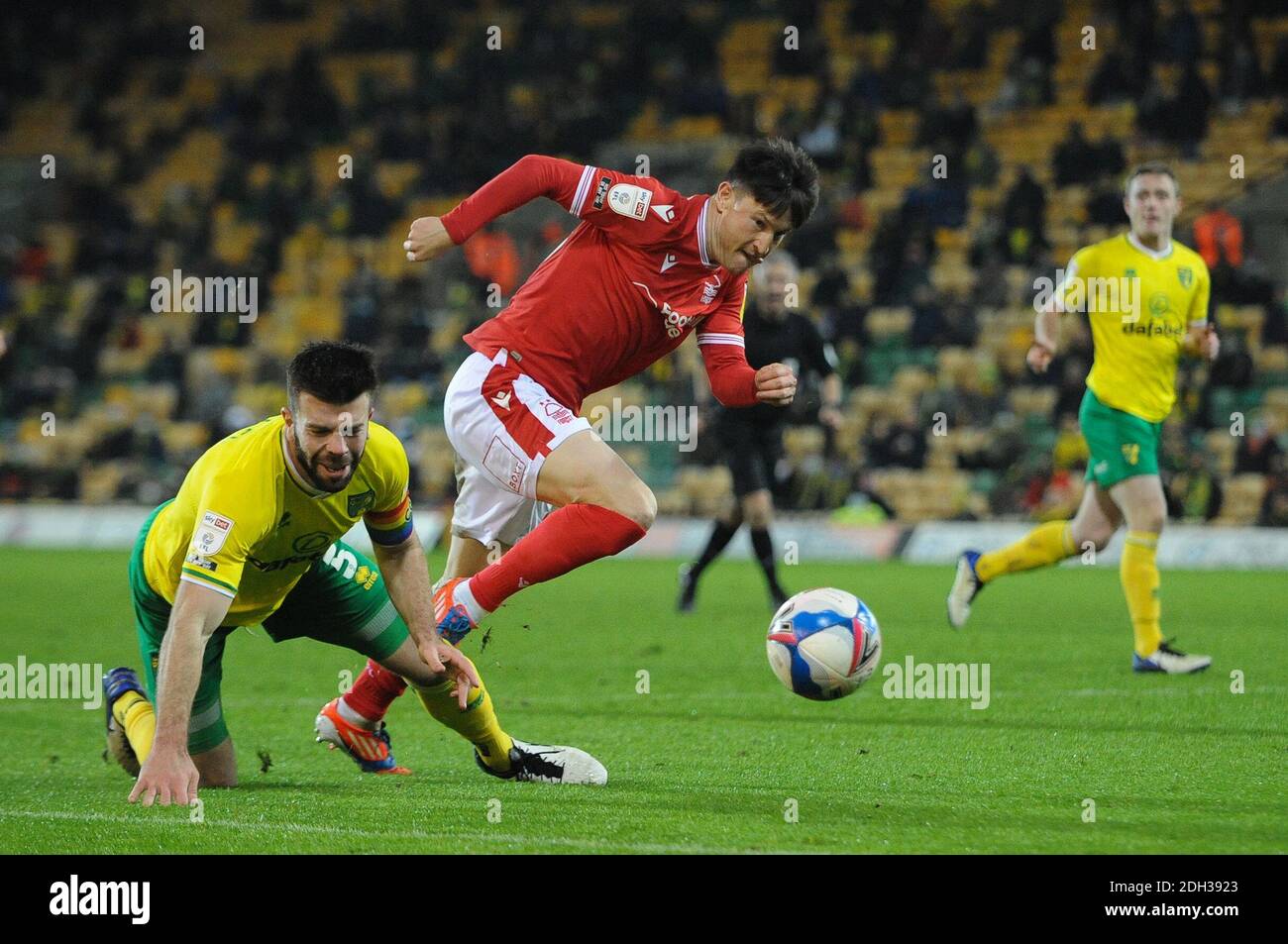 Norwich, UK. 9th Dec 2020. Nottinghams Joe Lolly fouls Norwichs Grant Hanley during the Sky Bet Championship match between Norwich City and Nottingham Forest at Carrow Road, Norwich on Wednesday 9th December 2020. (Credit: Ben Pooley | MI News) Credit: MI News & Sport /Alamy Live News Stock Photo
