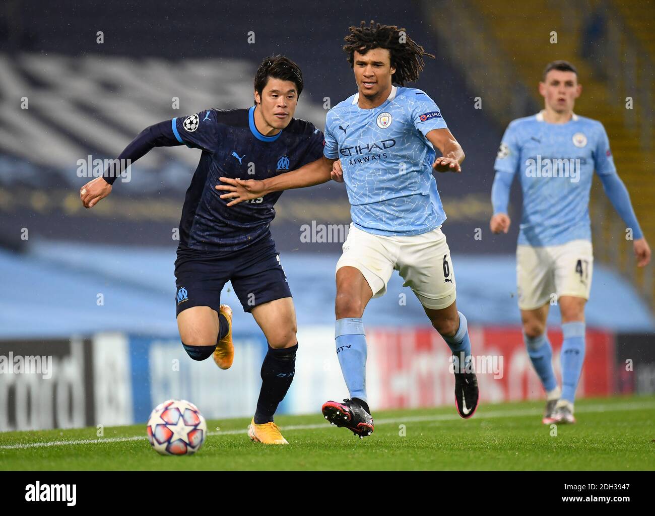 Marseille's Hiroki Sakai (left) and Manchester City's Nathan Ake battle for the ball during the Champions League match at the Etihad Stadium, Manchester. Stock Photo