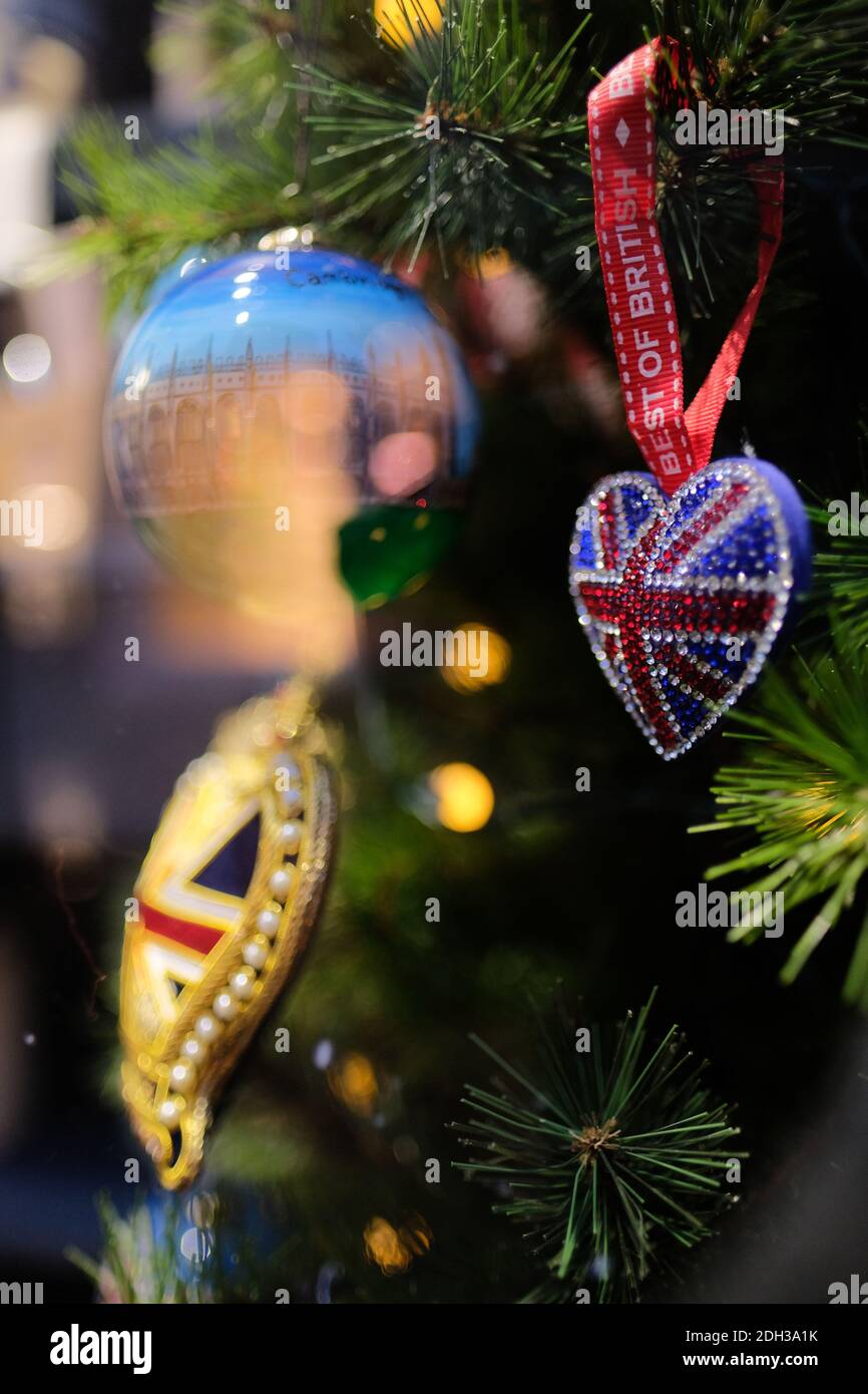 Cambridge UK December 2020 Christmas tree ornaments hanging on a green