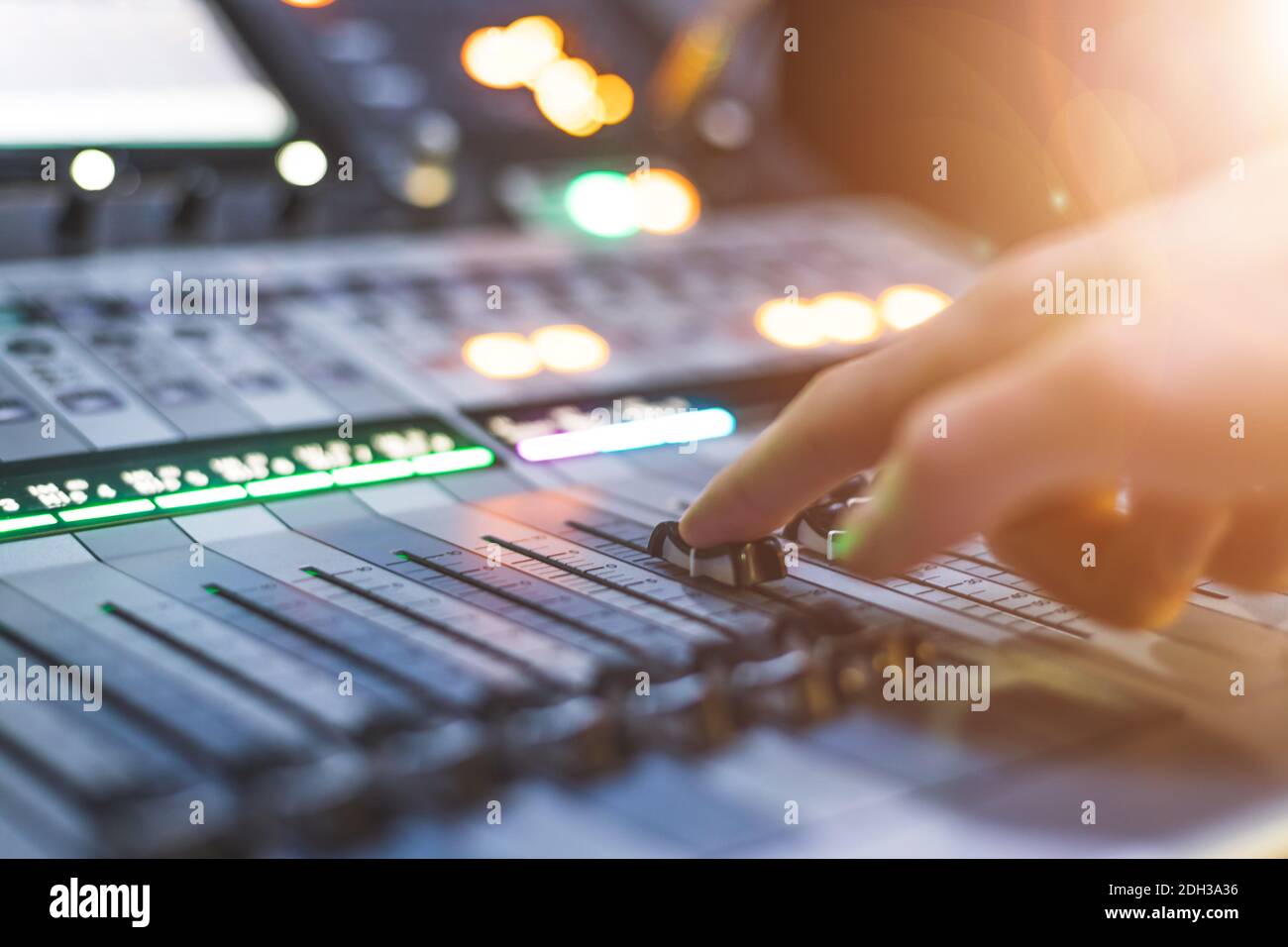 Sound Engineer Desk Sound recording studio mixer desk: sound engineer is operating a ...