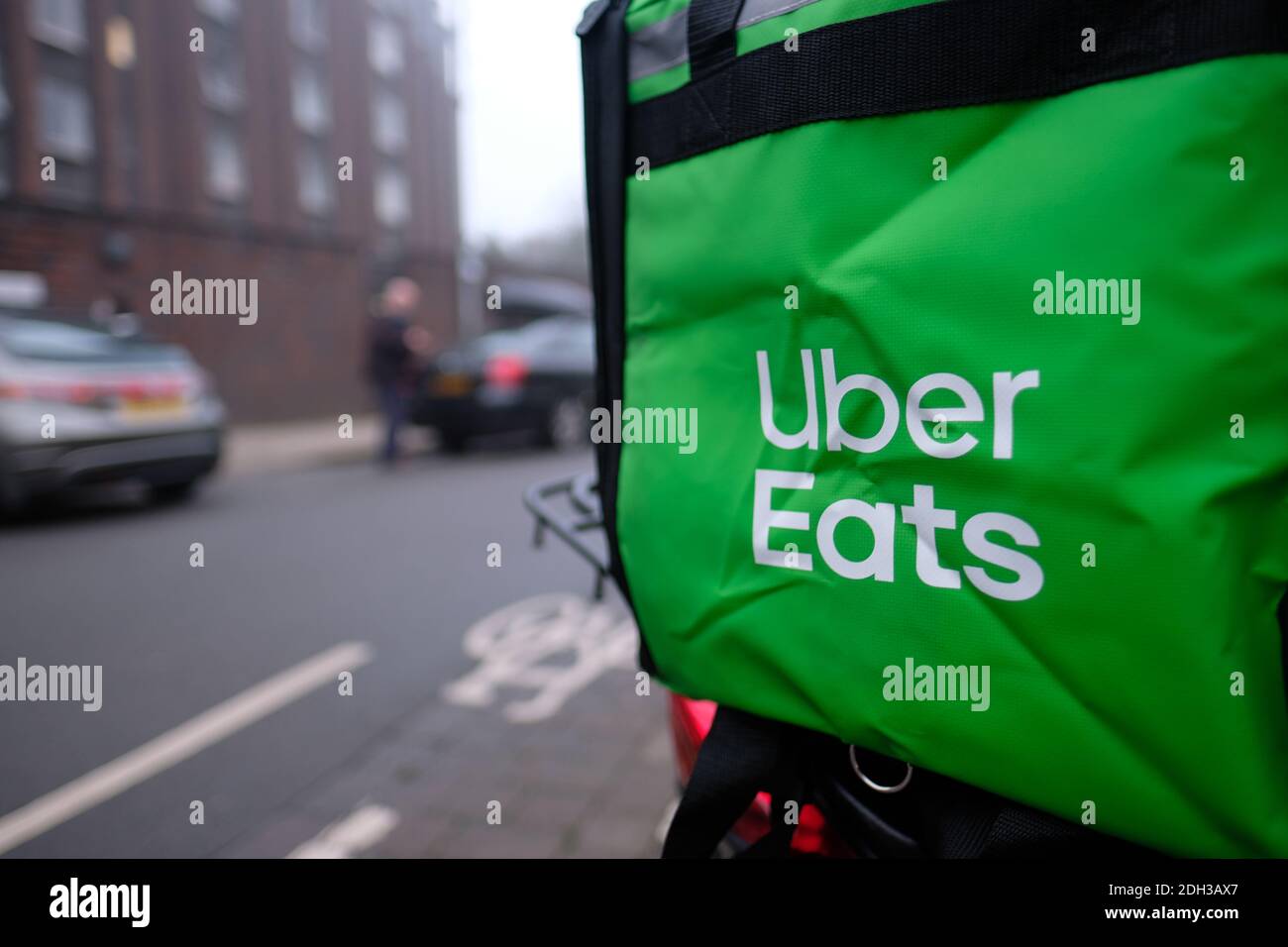 Cambridge UK December 2020 Closeup of a green Uber Eats delivery box on a  scooter, delivery guy picking up the food order Stock Photo - Alamy