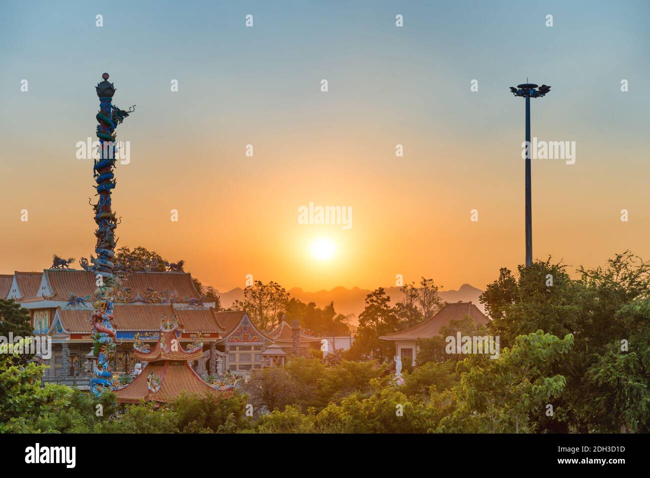 Chinese temple ornate with dragons at sunset Stock Photo