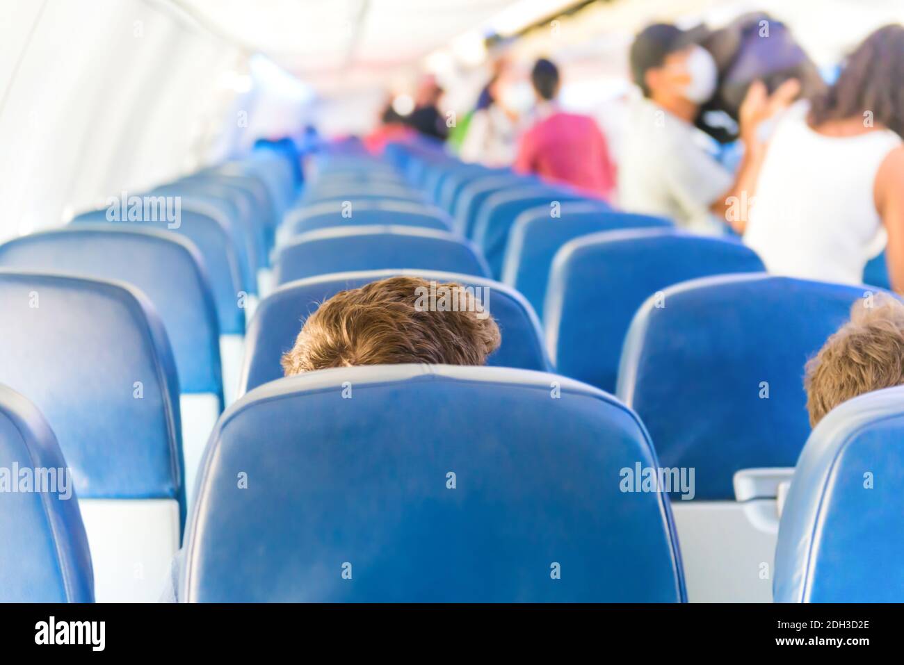 Empty plane interior with few people Stock Photo