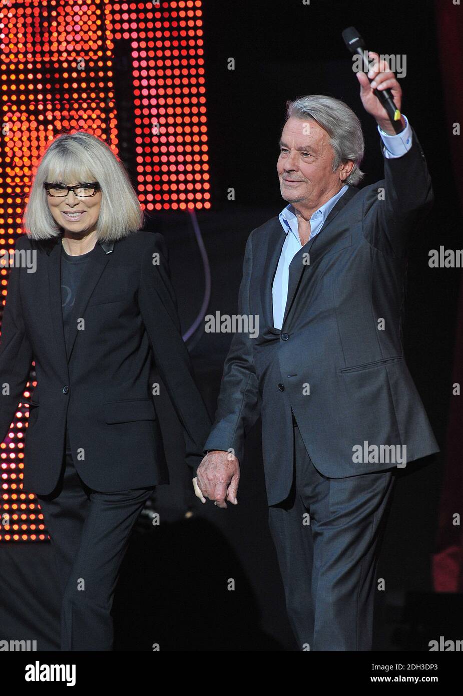 File photo - Alain Delon and Mireille Darc appearing on France 3's TV show 300 Choeurs Pour La Vie in La Plaine St-Denis, near Paris, France on September 24, 2012. Darc died at 79 it was announced today. She was Alain Delon's longtime co-star and companion. She appeared as a lead character in Jean-Luc Godard's 1967 film Week End. Photo by Giancarlo Gorassini/ABACAPRESS.COM Stock Photo
