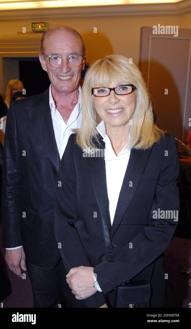File photo - French actress Mireille Darc (with her husband) wins the 2006 'Clarins woman Dynamisante Prize' in Paris, France, on May 19, 2006. The ceremony has been held at the Champs Elysees theater. Darc died at 79 it was announced today. She was Alain Delon's longtime co-star and companion. She appeared as a lead character in Jean-Luc Godard's 1967 film Week End. Photo by Bruno Klein/ABACAPRESS.COM Stock Photo