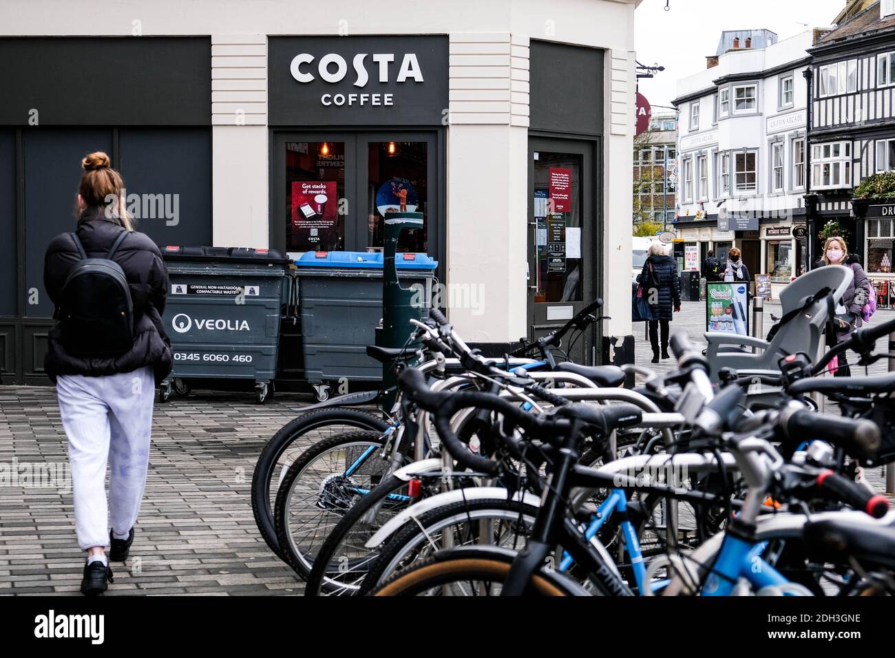 Kingston London, December 09 2020, Bicycles And People Outside A Costa Coffee Shop Front Stock Photo