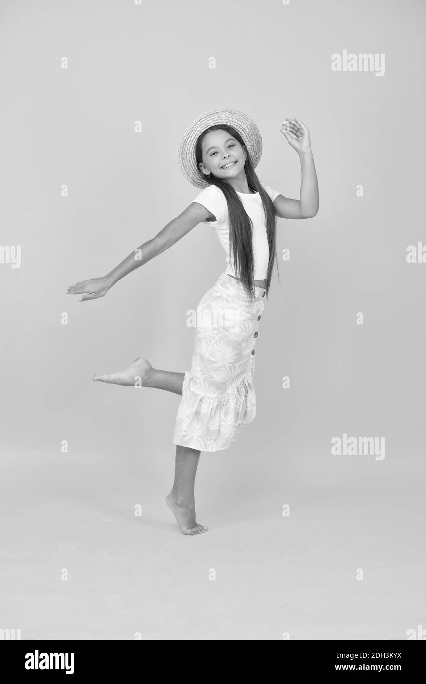 Happy little girl jumping in air on beach Black and White Stock Photos