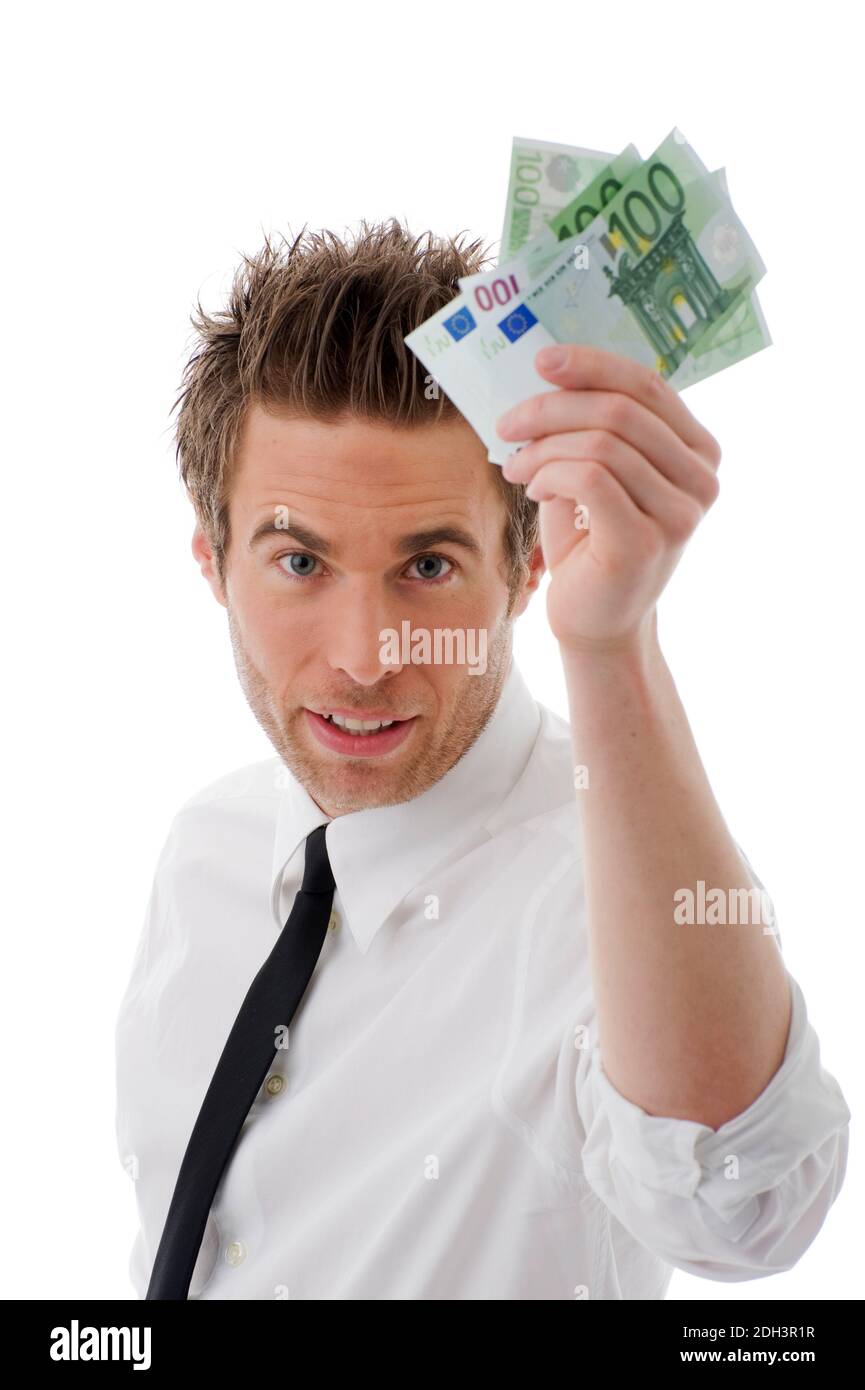 Mann, 25, 30, Jahre, Gecshäftsmann, hält Euro Banknoten in der Hand, Prämie, Bonus, Bestechung, Abgaben, Steuern, MR:Yes Stock Photo