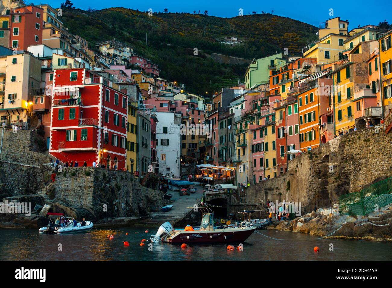 View of the colorful houses in Riomaggiore at sunset, Cinque Terre, Italy wallpaper Stock Photo