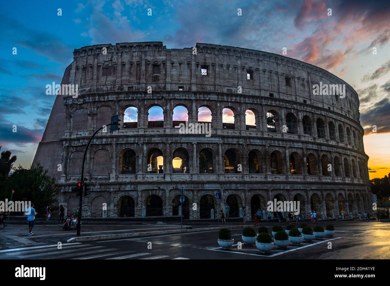 Side view of the famous Rome Colosseum during colorful sunset, Colosseum  wallpaper, Rome, Italy Stock Photo - Alamy
