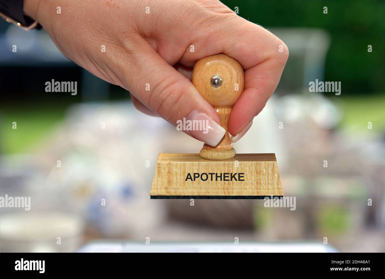 Hand mit Stempel, Frauenhand, Aufschrift: Apotheke Stock Photo
