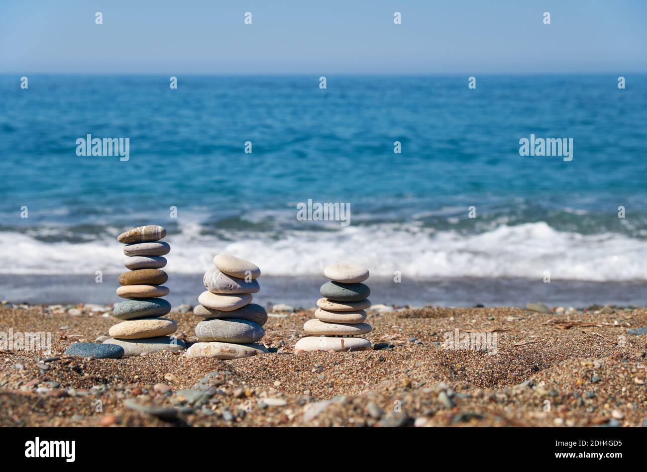 Stack of stones on Petra tou Romiou or Aphrodite Rock Beach, Cyprus Stock Photo