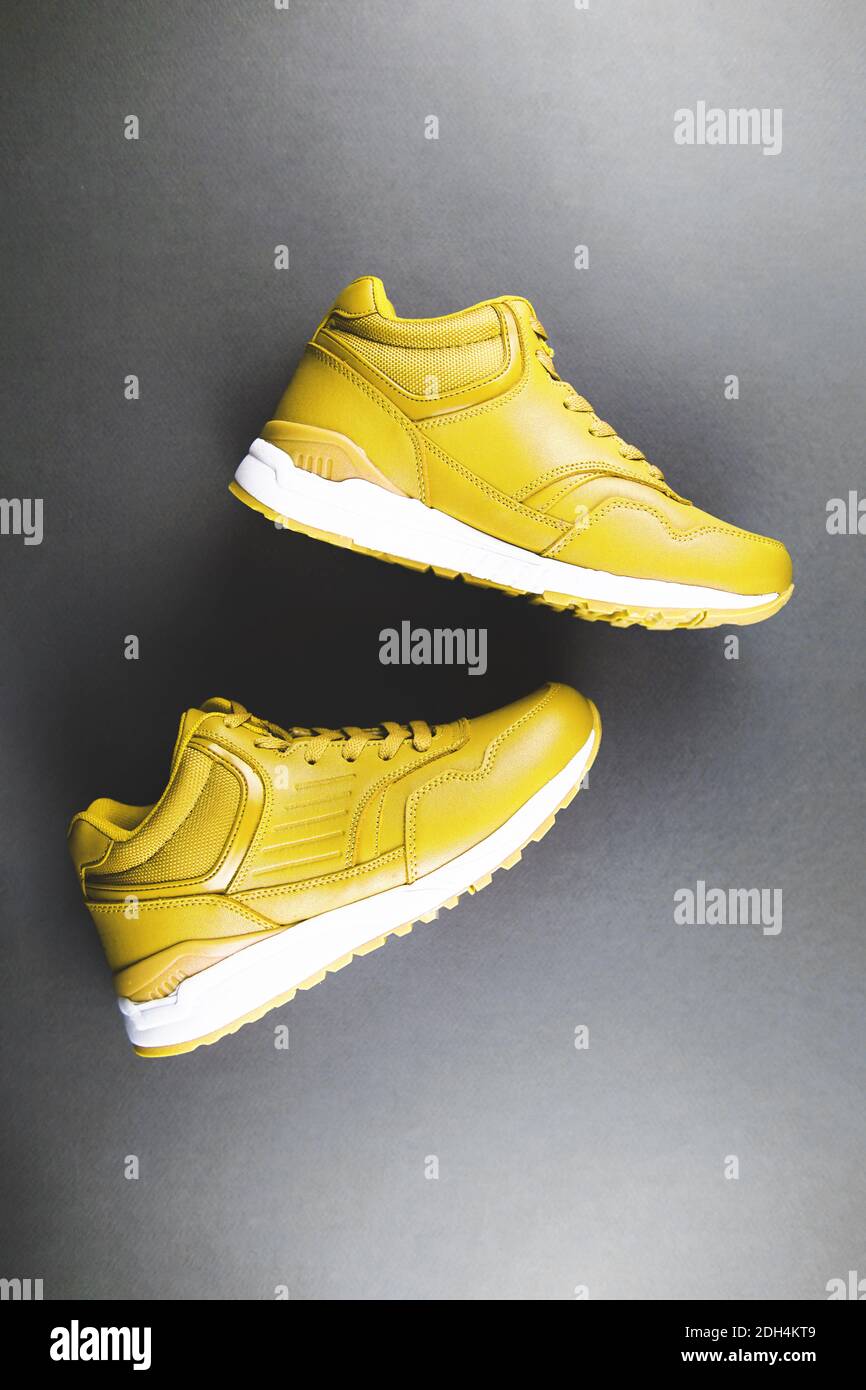 gray and yellow sneakers