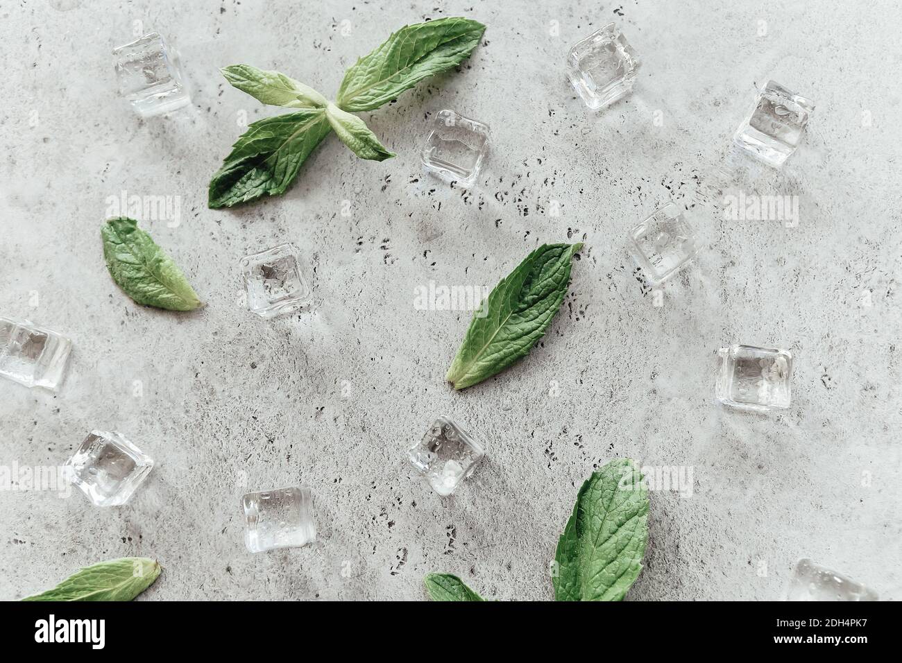 Mint leaves and ice cubes on table Stock Photo