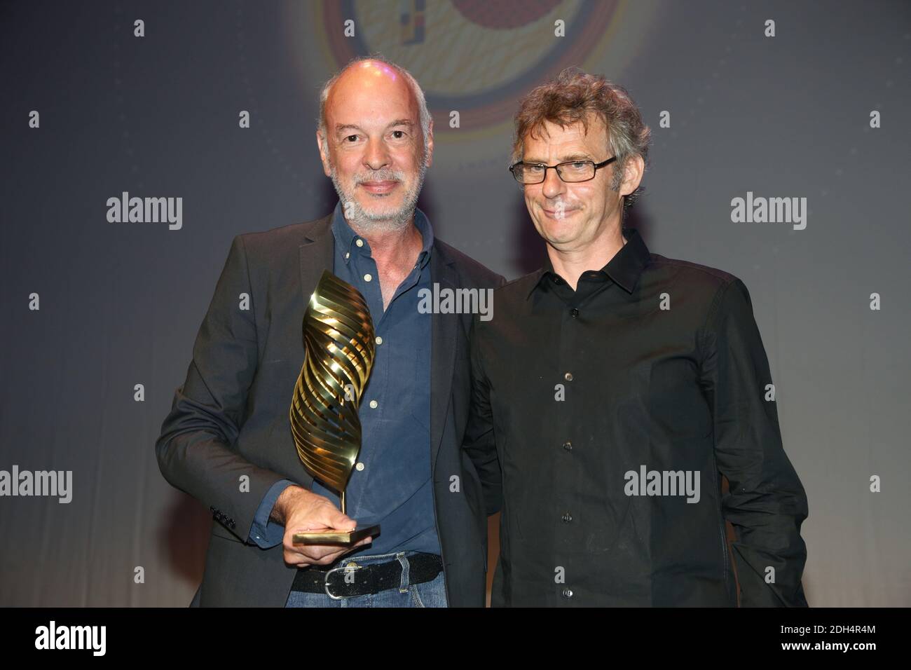 Philippe Van Leeuw is awarded for Une famille syrienne with Lucas Belveaux  during the closing ceremony of the 10th Angouleme Film Festival in Angouleme,  France on August 27, 2017. Photo by Jerome